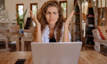 Woman frustrated by what she sees on computer screen